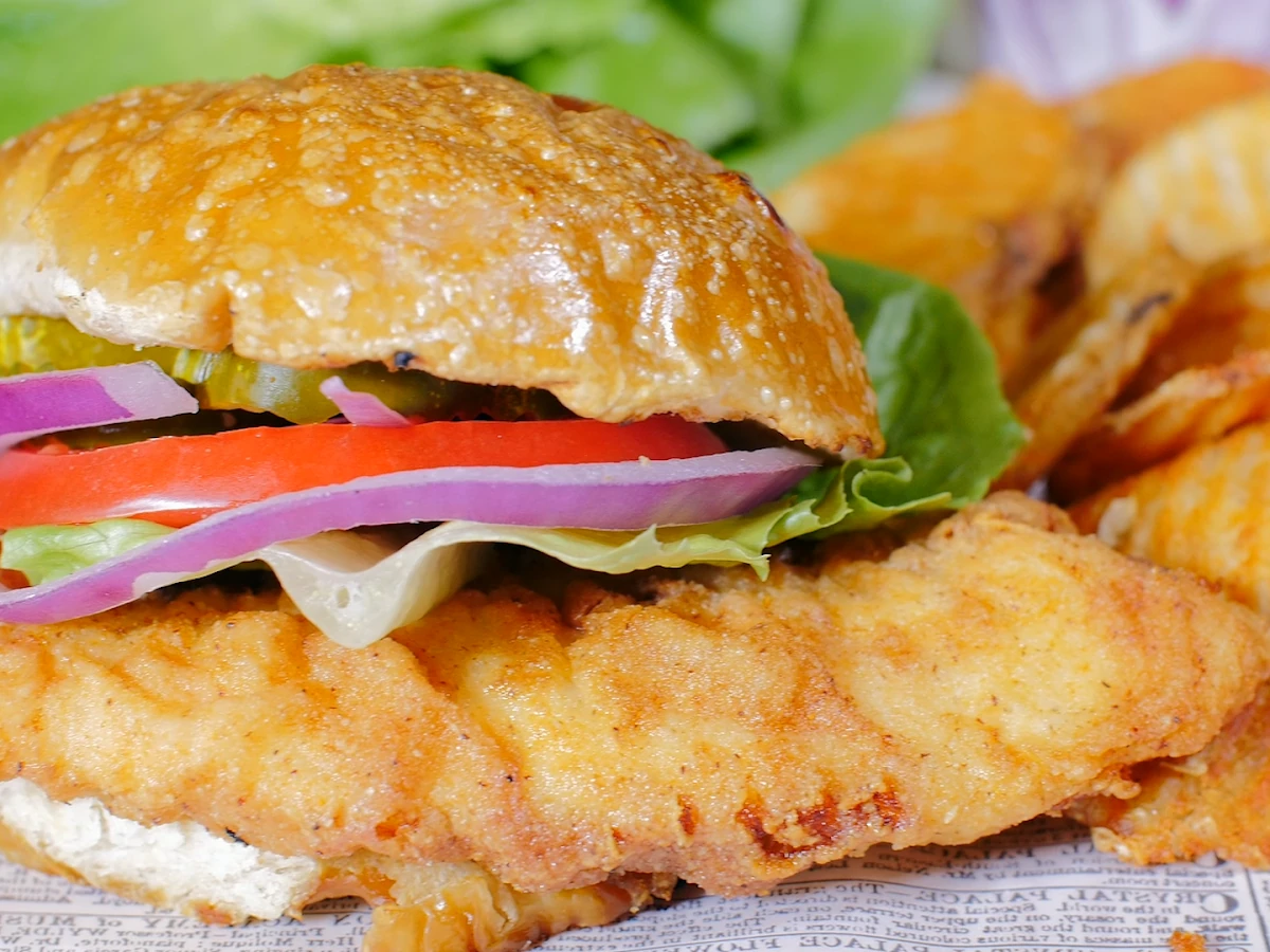 A golden fried fish sandwich and waffle fries from Caplinger's Fresh Catch in Indianapolis